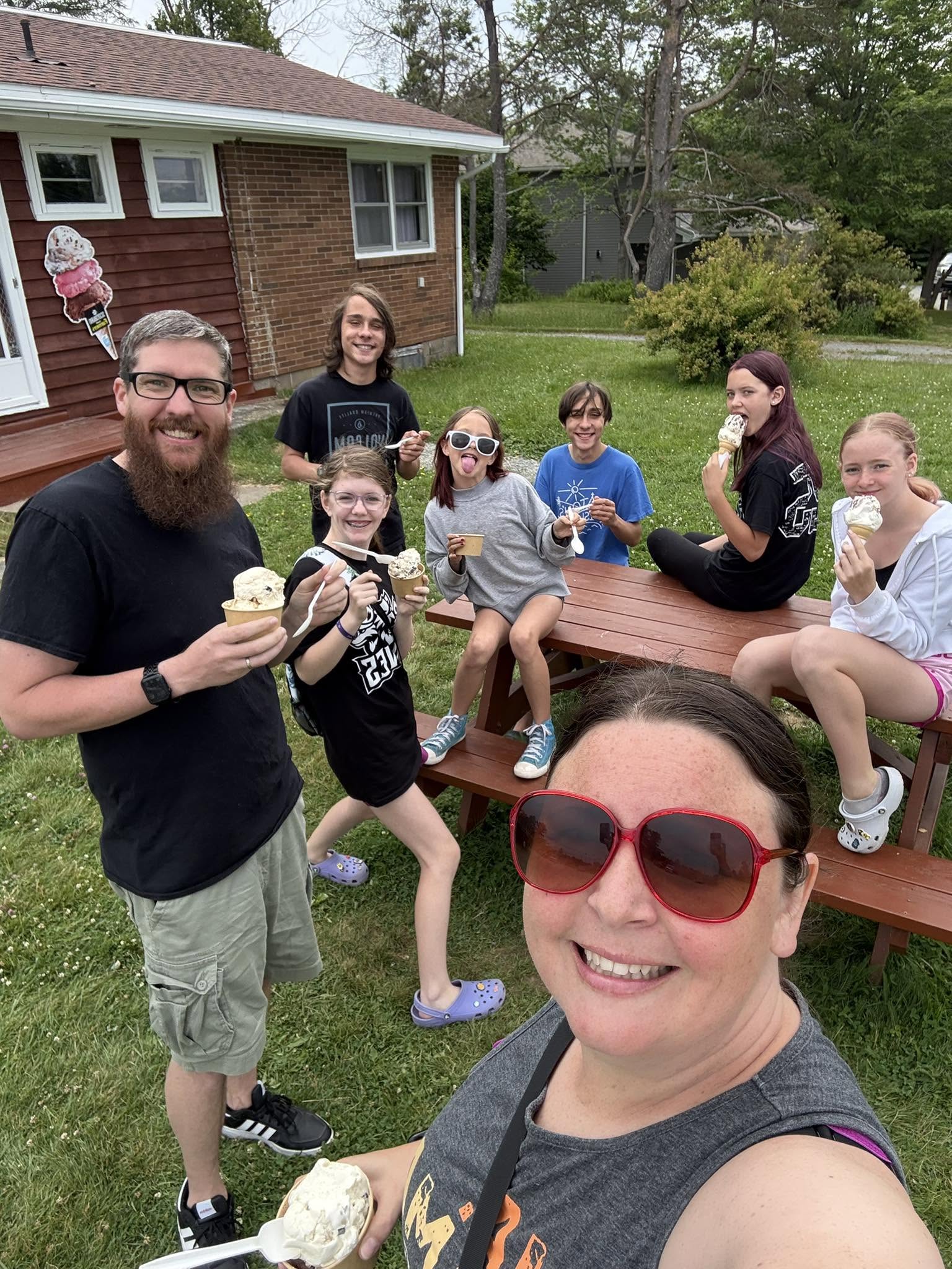Stefan and family eating ice cream outside.